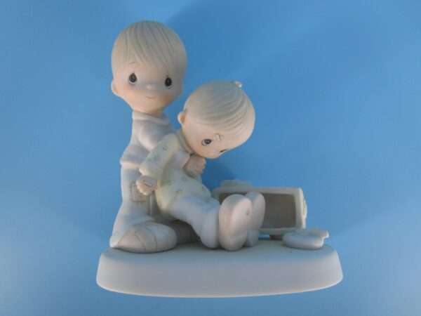 Precious Moments Figurine - Boy Helping Friend after Coaster Accident