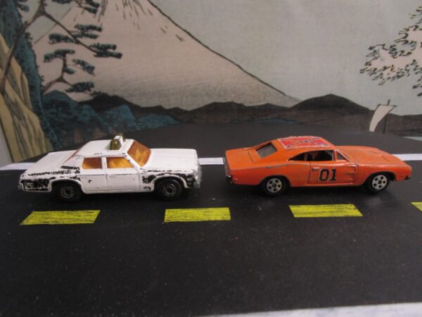 ERTL Dukes of Hazzard General Lee Dodge Charger and Matchbox Superfast No. 10 Plymouth Gran Grand Fury Police Car - Image 2