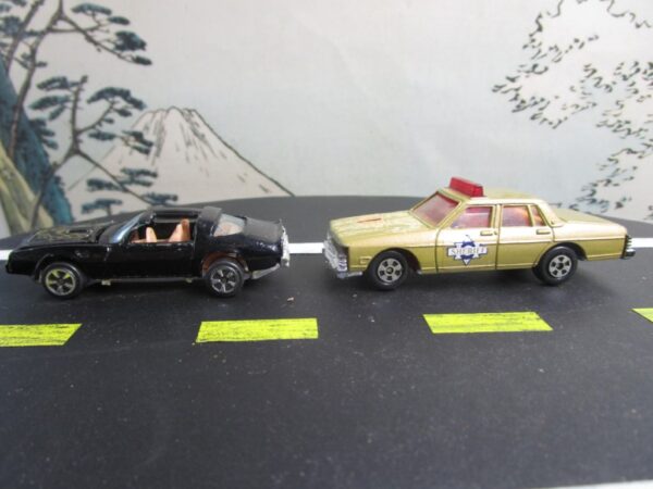 Kidco Pontiac Firebird Trans Am Black Gold Bird and ERTL 1980 Pontiac Bonneville Police Car